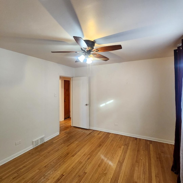 unfurnished room with ceiling fan and light hardwood / wood-style flooring