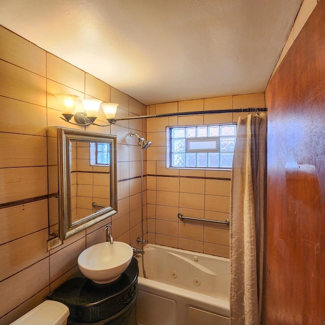 bathroom featuring sink and shower / tub combo with curtain