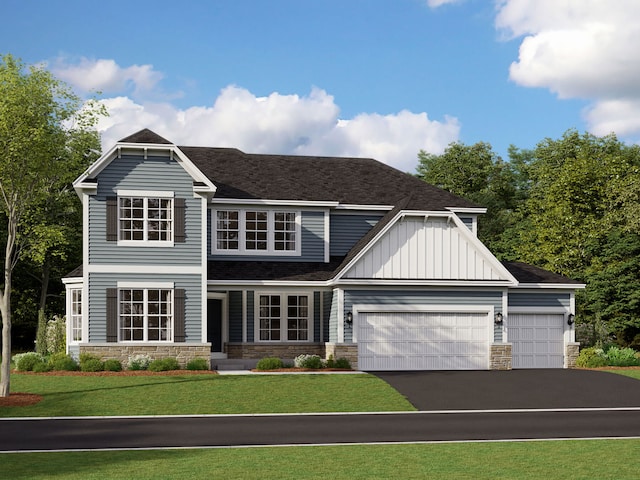 view of front of home with a garage and a front lawn