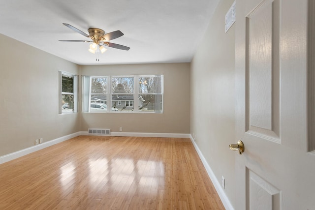 spare room featuring ceiling fan and light wood-type flooring