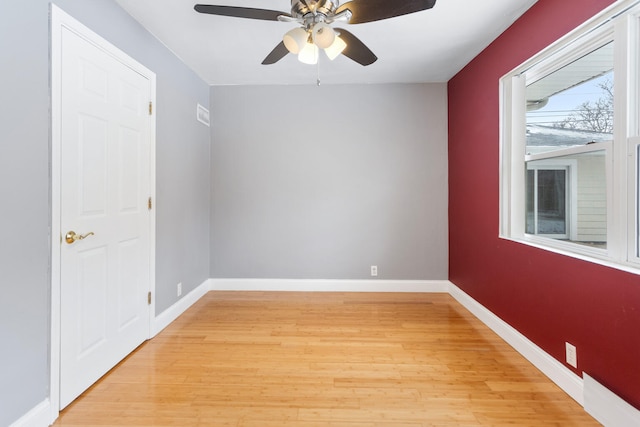 unfurnished room with ceiling fan and light hardwood / wood-style flooring