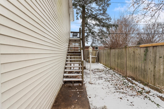 view of yard layered in snow