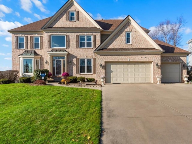 1666 Eagle Brook Dr, Geneva, IL 60134 - view of front of house featuring concrete driveway, brick siding, a front lawn, and a garage