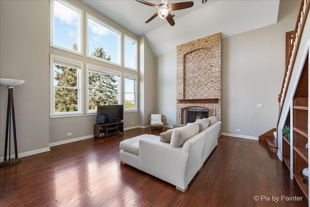 1666 Eagle Brook Dr, Geneva, IL 60134 - living area featuring ceiling fan, plenty of natural light, dark wood-style flooring, high vaulted ceiling, and baseboards
