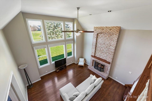 1666 Eagle Brook Dr, Geneva, IL 60134 - living area featuring wood finished floors, lofted ceiling, baseboards, a brick fireplace, and a ceiling fan