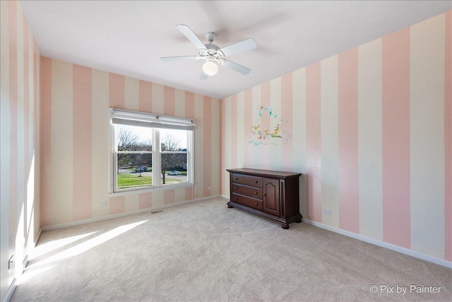 1666 Eagle Brook Dr, Geneva, IL 60134 - carpeted spare room with wallpapered walls, baseboards, and a ceiling fan