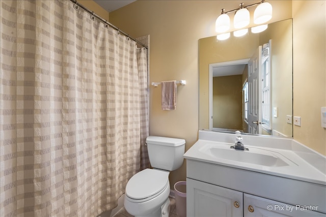 full bath featuring vanity and toilet