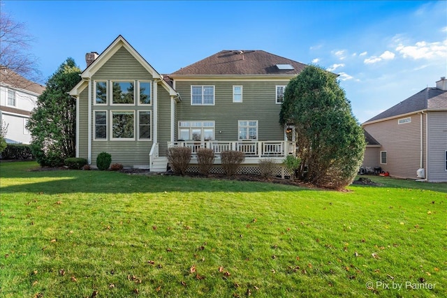 1666 Eagle Brook Dr, Geneva, IL 60134 - rear view of house featuring a chimney, a wooden deck, and a yard