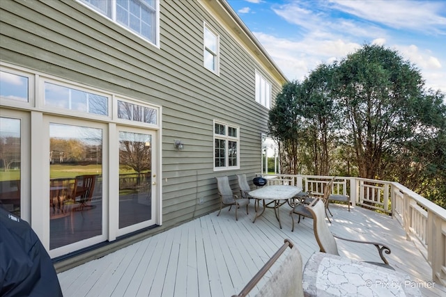 deck featuring outdoor dining area