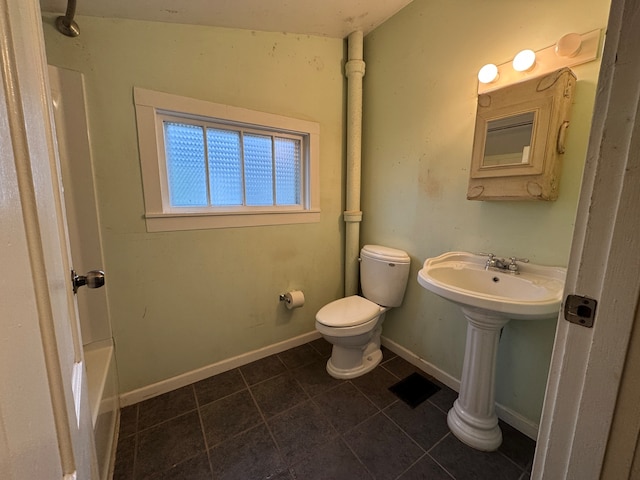 bathroom with tile patterned floors and toilet