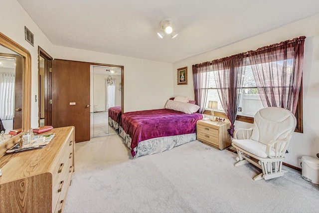 carpeted bedroom with a closet