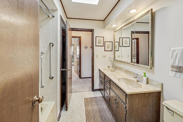 full bathroom with vanity, tiled shower / bath combo, and toilet