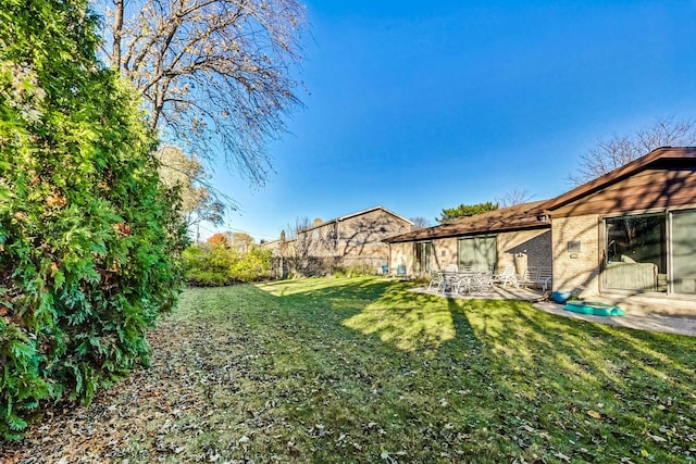 view of yard with a patio area