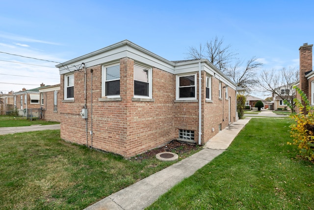 view of property exterior with a yard