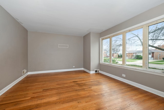 spare room with light hardwood / wood-style flooring