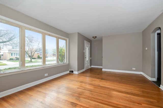 spare room with light wood-type flooring