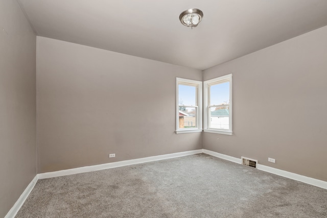 empty room featuring carpet flooring