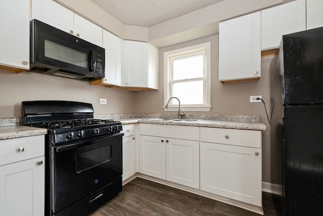 kitchen featuring white cabinets, sink, dark hardwood / wood-style floors, and black appliances