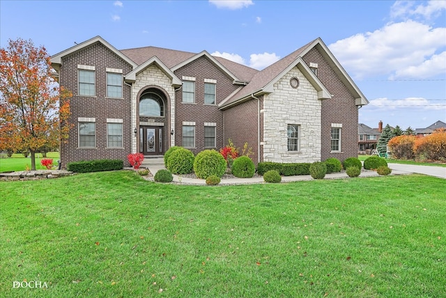 front facade with a front yard