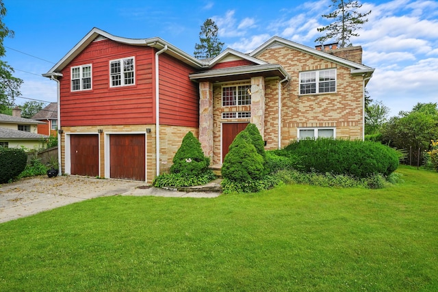 view of front facade featuring a garage and a front lawn