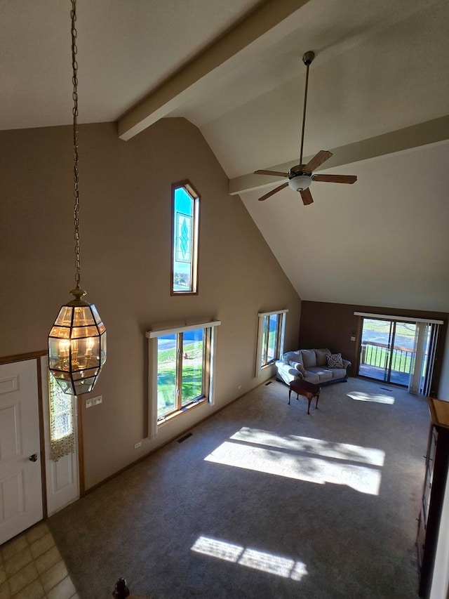 interior space featuring high vaulted ceiling, beamed ceiling, ceiling fan, and carpet floors