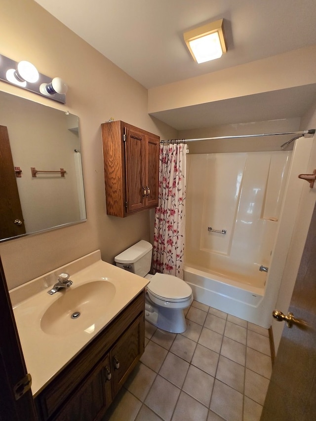 full bathroom featuring toilet, vanity, tile patterned floors, and shower / tub combo