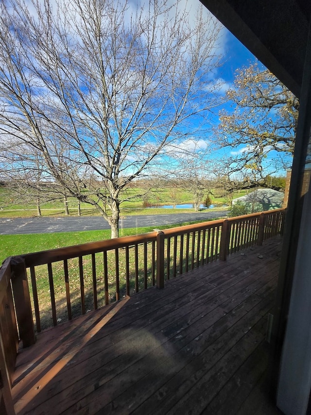 deck featuring a lawn