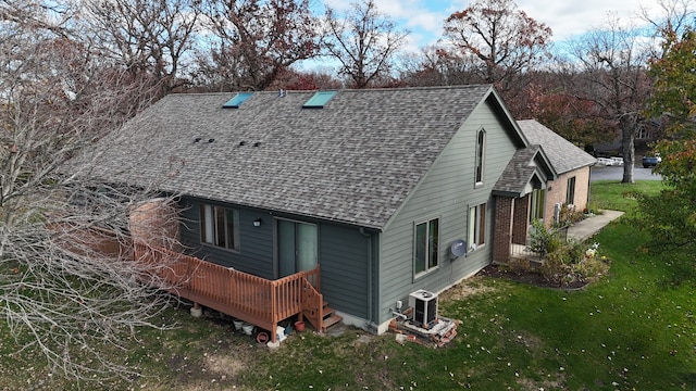 back of house featuring a yard