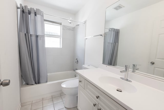 full bathroom featuring toilet, shower / bath combo, vanity, and tile patterned flooring