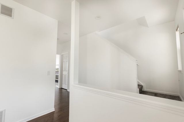 stairs featuring hardwood / wood-style flooring