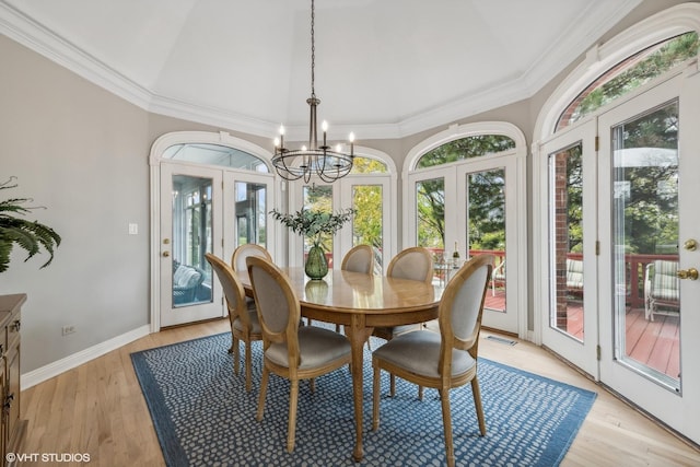 1100 Glencrest Dr, Inverness, IL 60010 - dining space with french doors, a chandelier, ornamental molding, light wood finished floors, and baseboards