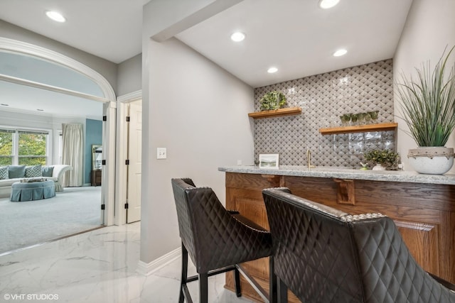 1100 Glencrest Dr, Inverness, IL 60010 - indoor wet bar featuring light marble finish floors, baseboards, and recessed lighting