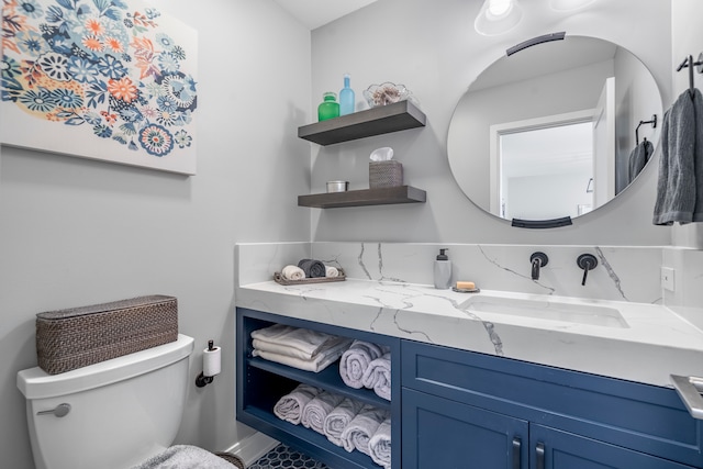 bathroom with toilet and vanity