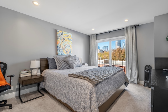 carpeted bedroom featuring access to outside