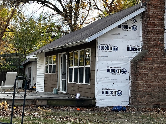 view of home's exterior featuring a deck