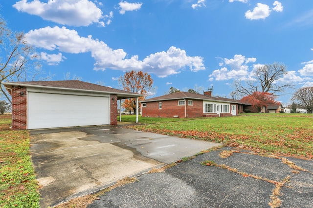 view of front facade with a front yard and a carport