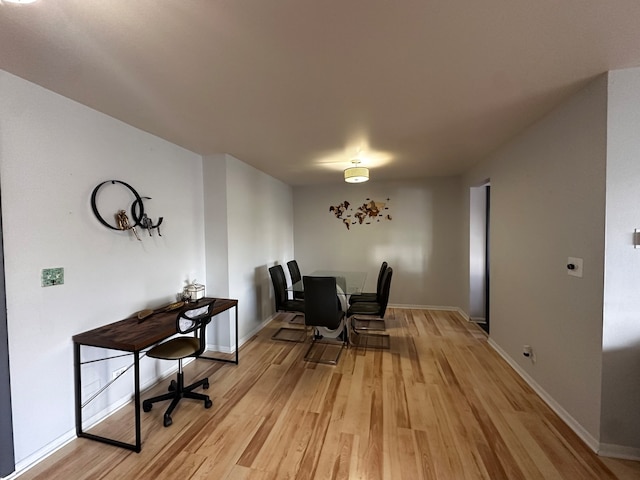 dining room with light wood-type flooring