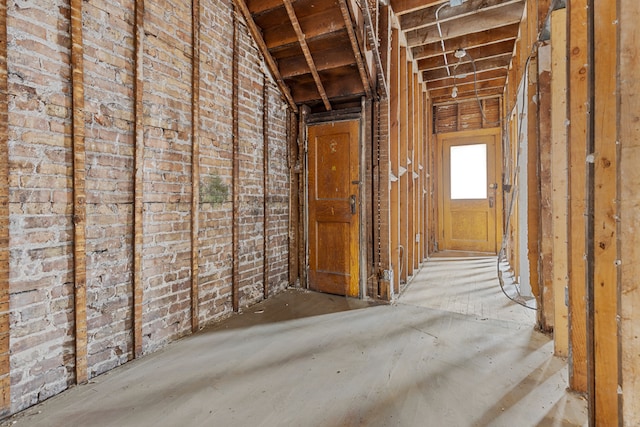 miscellaneous room featuring brick wall