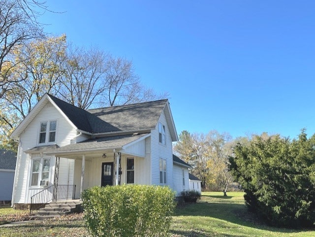 view of home's exterior featuring a yard