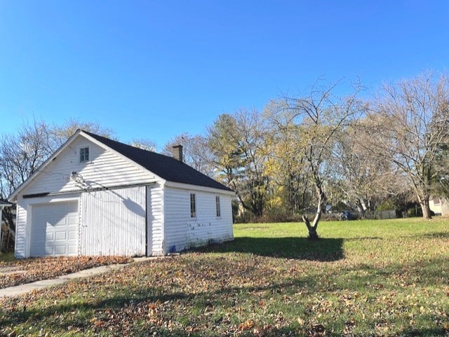 garage with a lawn