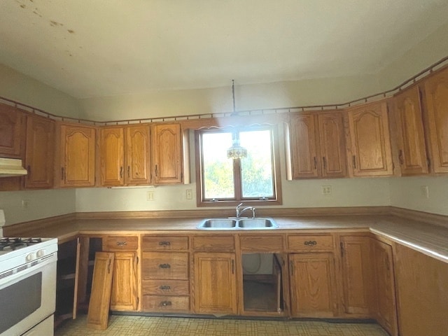 kitchen with sink and white gas range oven