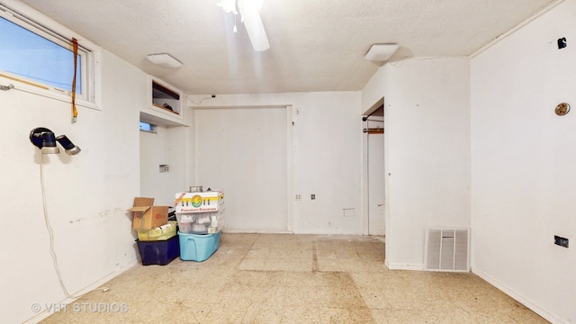 interior space featuring a textured ceiling