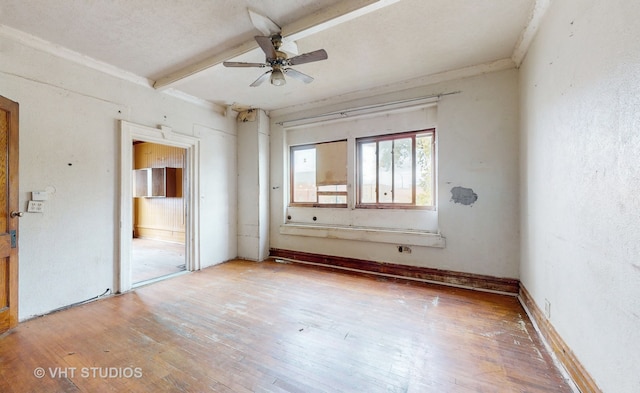 unfurnished bedroom with a textured ceiling, hardwood / wood-style flooring, and ceiling fan