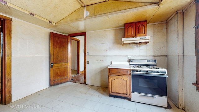 kitchen featuring white range with gas cooktop and vaulted ceiling