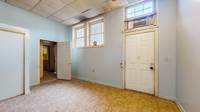 entrance foyer with a drop ceiling and cooling unit