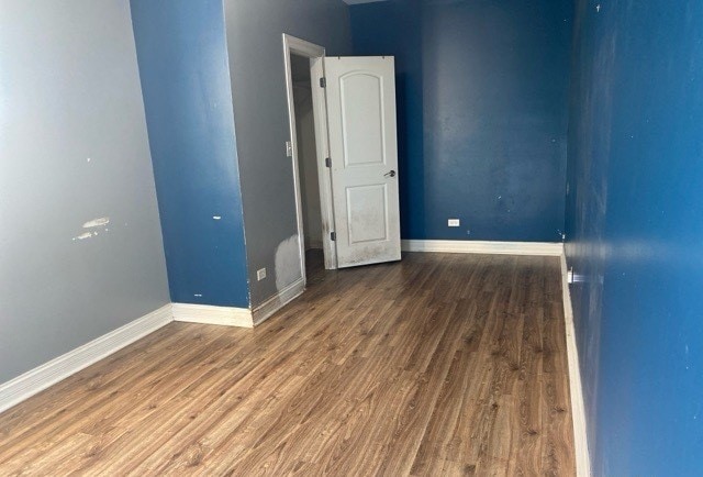 spare room featuring hardwood / wood-style floors