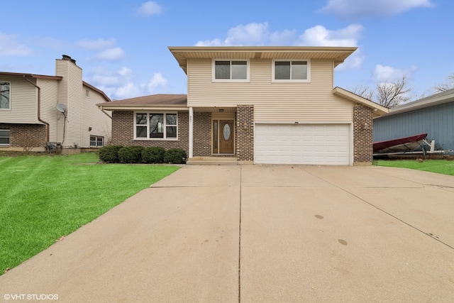 view of property featuring a front yard and a garage