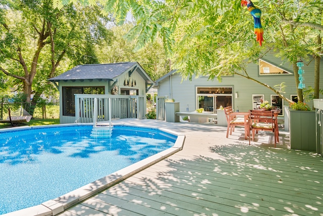 view of pool with a wooden deck