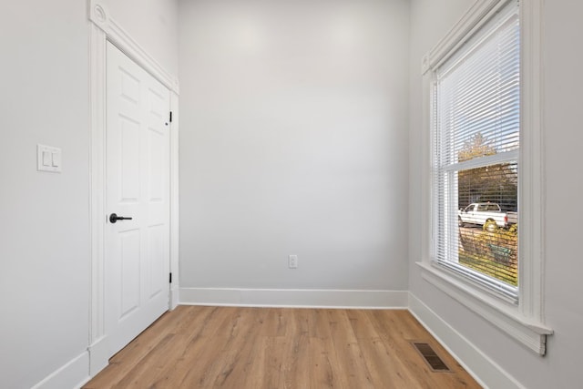 unfurnished room with light hardwood / wood-style floors