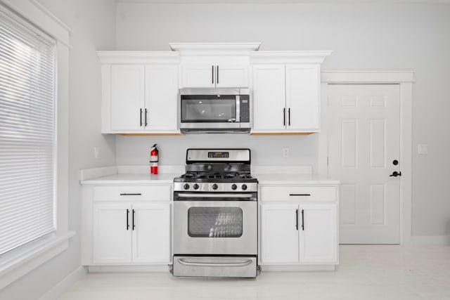 kitchen featuring white cabinets and stainless steel appliances